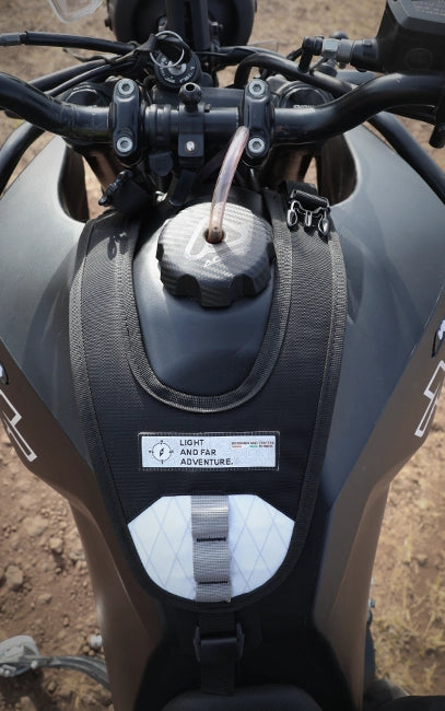 Y-Harness Platform Close-up of a motorcycle's handlebar and fuel tank with visible branding.